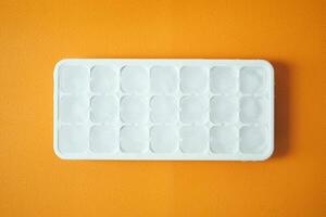 close up of many ice cubes on white background photo