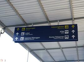 Signage at Indonesian train stations photo