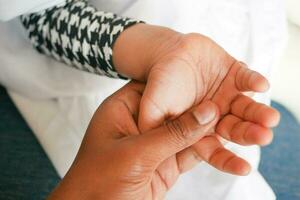 father holding hand of baby child, close up . photo