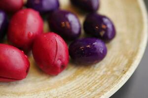 black, and red olives with lemon on a plate photo