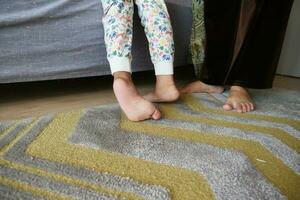 low angle view of A child walking on tiptoes photo