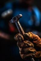 Close-up of a man's hand holding an old hammer, Labor day concept, labor day image, Generative Ai photo