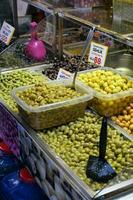 Buckets of olives for sale street food market photo