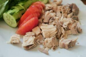 boiled Chicken fillet and vegetables on table . photo