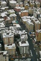 top view of Snowfall on buildings in istanbul city photo