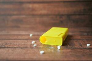 artificial sweetener container on table photo