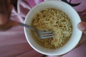 cooking noodles instant top view. photo