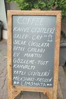 Cafe menu sign of different coffees selection photo