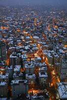 top view of Snowfall on buildings in istanbul city photo