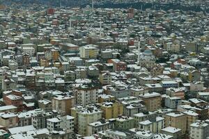 top view of Snowfall on buildings in istanbul city photo