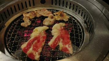 close up of sliced meat barbecued on charcoal in meat buffet restaurant in shopping mall video