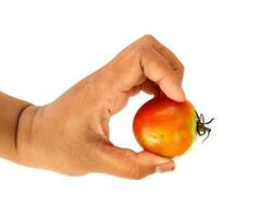 This is a tomato, a fruit that has many benefits and contains vitamins. photo