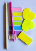 colourful sticky note with pencil and pen on the top for study, bussines photo