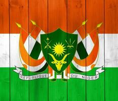 Flag and coat of arms of Republic of Niger on a textured background. Concept collage. photo