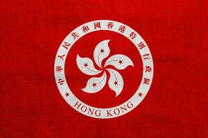 Flag and coat of arms of Hong Kong Special Administrative Region on a textured background. Concept collage. photo