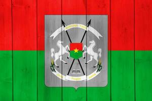 Flag and coat of arms of Burkina Faso on a textured background. Concept collage. photo