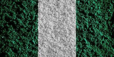 bandera de federal república de Nigeria en un texturizado antecedentes. concepto collage. foto