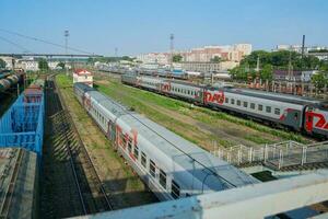 Train cars on rails at the station and freight cars, top view photo