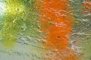 transparent orange yellow-green textured glass photo