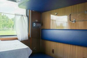 View of the empty seats in the lower second-class compartment wagon train photo