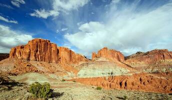 Red rock against a blue sky photo