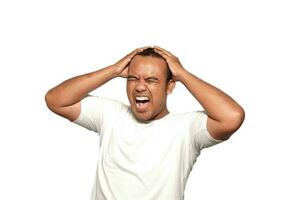 A photo of a Asian man stressed two hands holding stress head wearing a white T-shirt isolated by white background. looks depressed