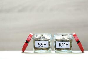 Retirement Mutual Fund, Coins money in the glass bottle on white background, Save money for prepare in future and pension retirement concept photo