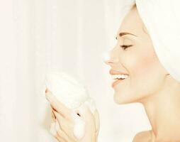 Healthy happy girl taking bath photo