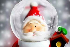 Santa Claus in the snow globe photo