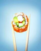 Sushi with chopsticks photo
