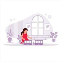 Cheerful girl playing toy train in the house. Trend Modern vector flat illustration.