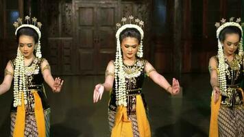 a group of Javanese dancers dances together while applying makeup video