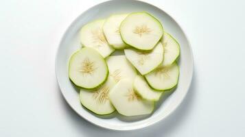 Photo of Kohlrabi slices on a plate isolated on white background