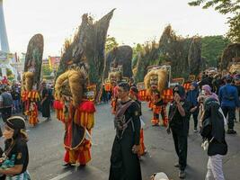 the Reog Ponorogo attraction at the Surabaya birthday celebration parade. Surabaya, indonesia - may, 2023 photo
