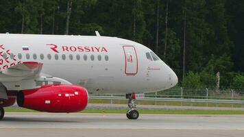 MOSCOW, RUSSIAN FEDERATION JULY 28, 2021 - Sukhoi Superjet 100 95B, RA 89014 of Rossiya taxiing at Sheremetyevo Airport SVO. Tourism and travel concept. Airplane on the taxiway video