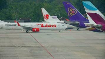 PHUKET, THAILAND NOVEMBER 30, 2016 - Thai Lion Air Boeing 737 HS LTI taxiing after landing at Phuket International airport. Low cost airline Thai Lion arrive video