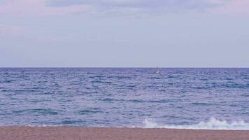 A solitary boat sailing on the vast ocean video