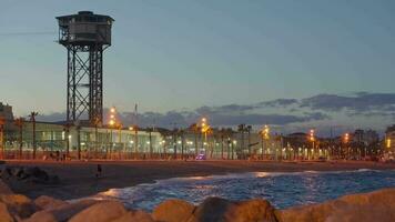 A beach at night with a large tower in the background video