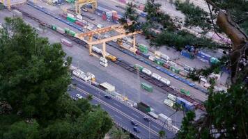 A train yard with a crane in the middle video