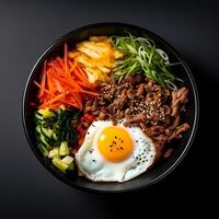 Photo of Bibimbap on dark bowl isolated on black background. Created by Generative AI