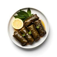 Photo of dolma with lemon on plate isolated on white background. Created by Generative AI