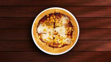 Rotating Sweet Corn Pizza on Wooden Table video