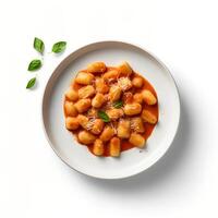 Photo of Gnocchi with sauce on plate isolated on white background. Created by Generative AI