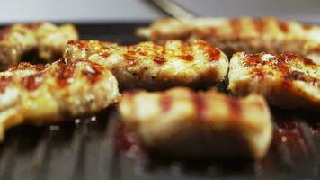 Close-up. Preparation of fried meat on the electric grill. Delicious pork. Beef. a static frame. video