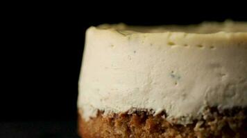 Video about cheesecakes is rotated on a black background close up