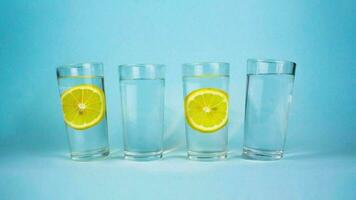 Stop Motion animation video glasses of water with lemon and mint. A few glasses of water per day