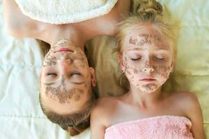 Girls with facial masks of chia seeds. Top view. photo