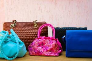 colored handbags closeup photo
