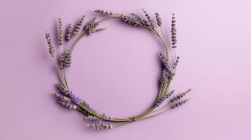 , wreath of lavender branches flowers with copy space, natural organic floral frame violet background photo