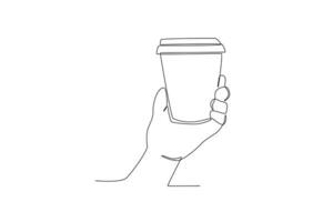 Hand holding cup of coffee vector